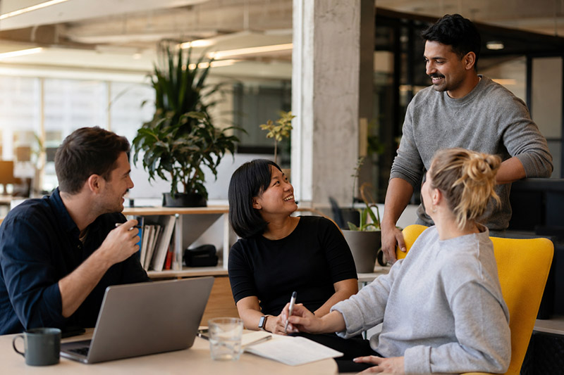 Collaborative office discussion in modern workspace