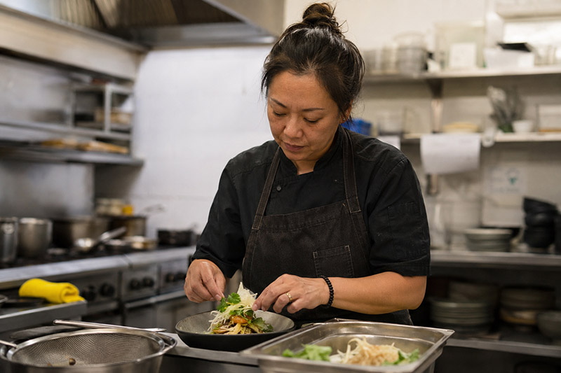 Focused plating in a professional kitchen