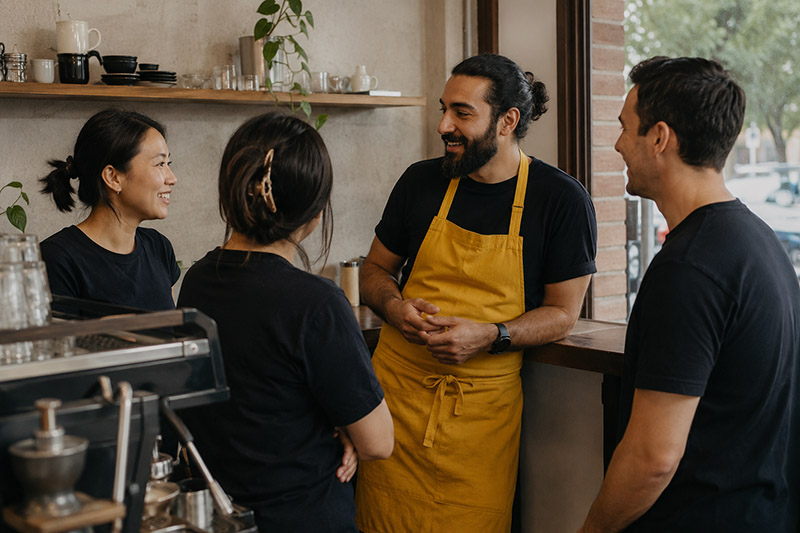 Friendly cafe chat and espresso machine