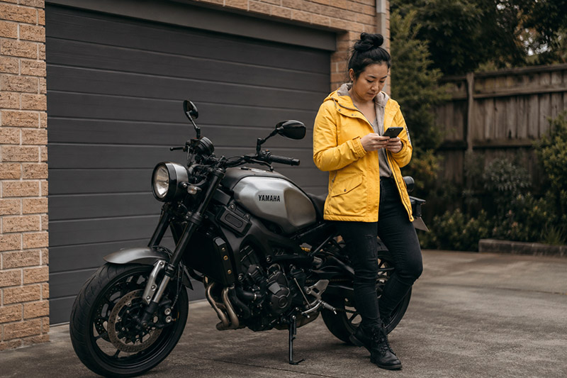 Motorcycle and smartphone in the driveway